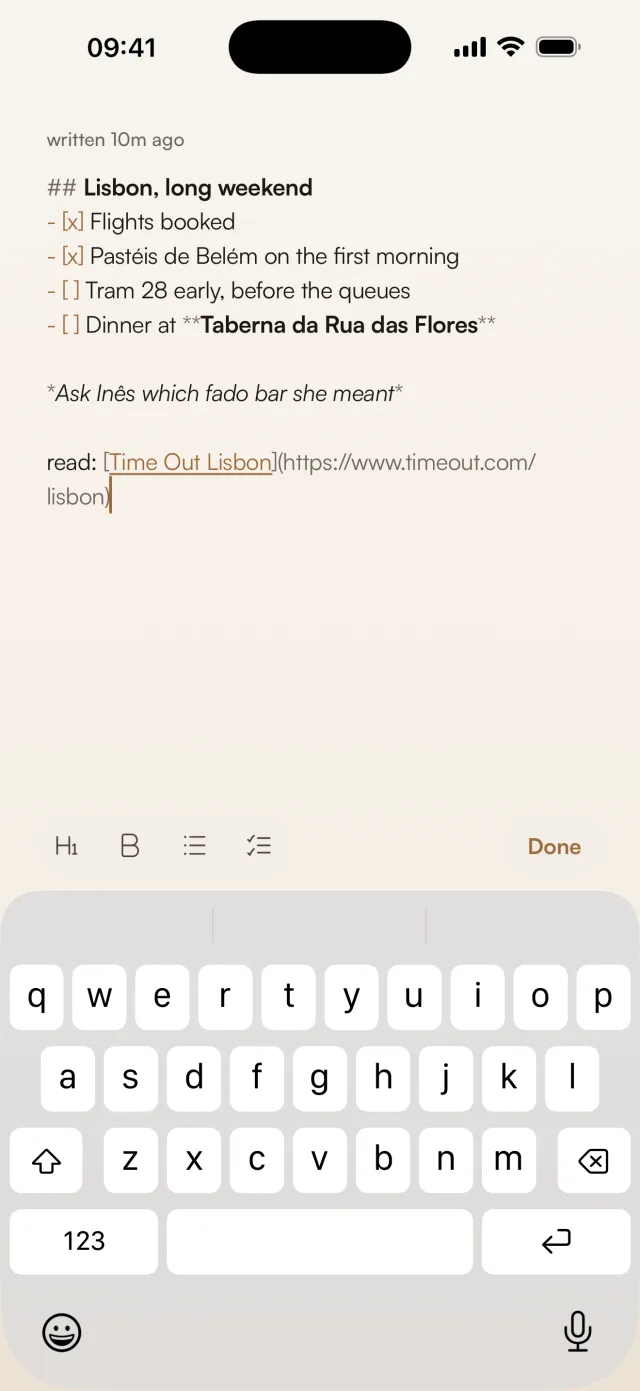 Gravity's Markdown editor on iPhone showing a Lisbon weekend note with a heading, a checklist, bold and italic text and a link, above a formatting bar with heading, bold, list, checklist and Done buttons